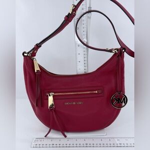 Michael Kors Rhea leather hobo bag in a red/mulberry